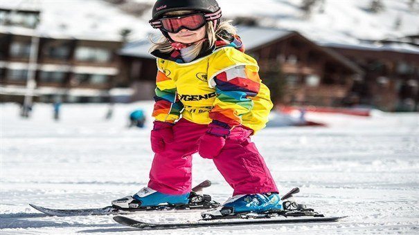 Little one on skis on holiday.