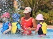 Children in swimming pool with Nanny
