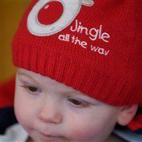 Baby wearing a red hat