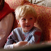 Child with family in sitting area