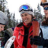Ski host and guests at ski hire