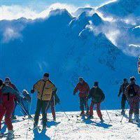 Top of piste, skiiers about to descend