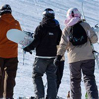 skiers walking around in the snow in moris