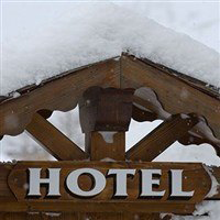 Hotel sign with snow on top