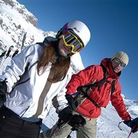 Couple in ski gear