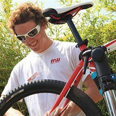 man fixing bike in lemnos