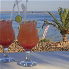 cocktails overlooking the sunny ocean in lakitira
