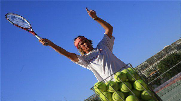 tennis instructor in action in lakitira