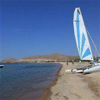 view of beach in lemnos with sailboats on shore