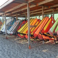 sails hanging in levante beach shack overlooking the beach
