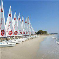 San Lucianu beach and sailing boats.