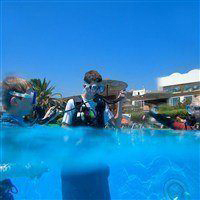 children scuba diving in lakitira