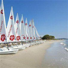 San Lucianu beach and sailing boats