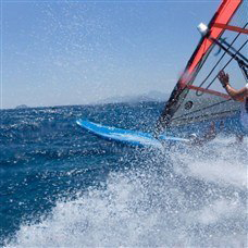 person windsurfing on holiday in lakitira