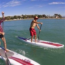 Man supboarding out at sea