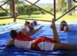 instructor teaching guest how to windsurf in lakitira